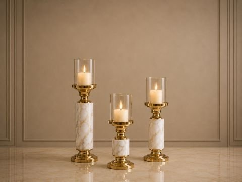 Marble candle stand set with gold accents and lit candles